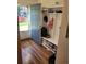 Well-organized mud room with a storage bench and built-in shelving near the front entry at 15507 E Louisiana Ave, Aurora, CO 80017