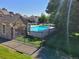 Community pool surrounded by lush landscaping and a black metal fence at 15507 E Louisiana Ave, Aurora, CO 80017