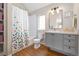 Charming bathroom with a shower-tub combo and modern vanity at 1691 W 66Th Ave, Denver, CO 80221