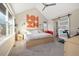 Bright bedroom with vaulted ceilings, neutral tones, and a sliding barn door to bathroom at 1691 W 66Th Ave, Denver, CO 80221