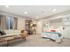 Spacious bedroom featuring comfortable seating, recessed lighting, and a pull-out Murphy bed for added versatility at 1691 W 66Th Ave, Denver, CO 80221