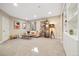 Spacious bedroom with sofa seating, recessed lighting, and stylish shelves and cabinets for storage at 1691 W 66Th Ave, Denver, CO 80221