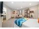 Cozy bedroom with modern decor, recessed lighting, and a convenient ensuite bathroom for added privacy at 1691 W 66Th Ave, Denver, CO 80221