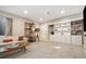Large bedroom offering a sofa, neutral walls and carpet, and a built-in bookcase with cabinets at 1691 W 66Th Ave, Denver, CO 80221
