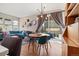Open-concept dining room featuring a modern chandelier and access to the outdoor patio at 1691 W 66Th Ave, Denver, CO 80221