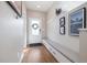 Inviting entryway with built-in bench and modern decor next to a front door at 1691 W 66Th Ave, Denver, CO 80221