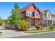 Charming two-story home featuring a cozy front porch and vibrant landscaping at 1691 W 66Th Ave, Denver, CO 80221