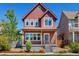 Inviting two-story home featuring a charming front porch and well-maintained landscaping at 1691 W 66Th Ave, Denver, CO 80221