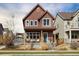Charming two-story home featuring a covered front porch, neat landscaping, and inviting curb appeal at 1691 W 66Th Ave, Denver, CO 80221