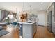 Spacious open-concept kitchen and living area with modern finishes and natural light at 1691 W 66Th Ave, Denver, CO 80221