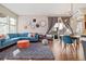 Bright living room with large windows, stylish decor, and a comfortable seating area at 1691 W 66Th Ave, Denver, CO 80221