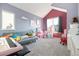 Bright and playful ' room with colorful accents, a vaulted ceiling, and lots of natural light at 1691 W 66Th Ave, Denver, CO 80221