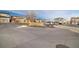 Wide view of a modern residential street with well-maintained landscaping and parked cars at 1691 W 66Th Ave, Denver, CO 80221