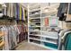 Spacious walk-in closet with custom shelving offers ample storage for clothes, shoes, and accessories at 1691 W 66Th Ave, Denver, CO 80221