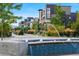 Modern townhomes backing to water fountains and lush, green landscaping and pedestrian walkways at 1691 W 66Th Ave, Denver, CO 80221