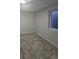 The basement showcases neutral walls and carpet with natural light from the basement window at 2767 W Iliff Ave # 1, Denver, CO 80219