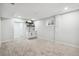 Finished basement with plush carpeting, sink, and modern shelving at 2767 W Iliff Ave # 1, Denver, CO 80219