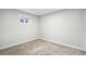 Carpeted bedroom with window at 2767 W Iliff Ave # 1, Denver, CO 80219