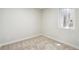Well-lit bedroom features soft carpet and window bringing in natural light at 2767 W Iliff Ave # 1, Denver, CO 80219
