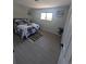 Cozy bedroom with a comfortable bed, stylish decor, natural light, and wood-look floors at 2767 W Iliff Ave # 1, Denver, CO 80219