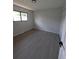 Clean and comfortable bedroom with new flooring and ample natural light at 2767 W Iliff Ave # 1, Denver, CO 80219