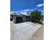 Detached single car garage and driveway with sunny sky at 2767 W Iliff Ave # 1, Denver, CO 80219