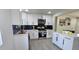 Well-equipped kitchen with black backsplash, stainless steel appliances, and ample cabinet space at 2767 W Iliff Ave # 1, Denver, CO 80219