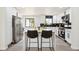 Stylish kitchen with stainless steel appliances, white cabinetry, and a functional island for meal prep at 2767 W Iliff Ave # 1, Denver, CO 80219
