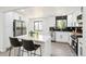 Updated kitchen featuring black subway tile backsplash, an island and stainless steel appliances at 2767 W Iliff Ave # 1, Denver, CO 80219