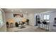 Bright and airy living room open to kitchen featuring modern decor and lots of natural light at 2767 W Iliff Ave # 1, Denver, CO 80219