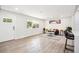 Bright living room featuring wood-look flooring and a modern design with neutral colors at 2767 W Iliff Ave # 1, Denver, CO 80219