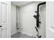 Plumbing in the utility room is visible on the neutral colored wall, with speckled flooring at 2767 W Iliff Ave # 1, Denver, CO 80219