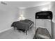 Cozy bedroom featuring neutral decor and space for fitness equipment at 7318 S Xenia Cir # B, Centennial, CO 80112