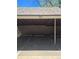 Assigned carport featuring unit number and individual storage available at 7318 S Xenia Cir # B, Centennial, CO 80112
