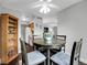Cozy dining area featuring a round table with seating for four and modern ceiling fan at 7318 S Xenia Cir # B, Centennial, CO 80112