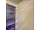 Close-up of a purple front door with secure access panel and white trim at 7318 S Xenia Cir # B, Centennial, CO 80112
