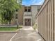 Inviting condo entrance with a well-lit walkway and manicured lawn at 7318 S Xenia Cir # B, Centennial, CO 80112