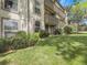 Multi-story condo building with balconies and lush greenery in a well-maintained community at 7318 S Xenia Cir # B, Centennial, CO 80112