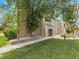 Attractive condo building with well-maintained landscaping and mature trees at 7318 S Xenia Cir # B, Centennial, CO 80112