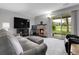 Inviting living room with stone fireplace, plush seating, and a sliding glass door at 7318 S Xenia Cir # B, Centennial, CO 80112