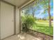 Cozy patio with green foliage creating privacy and view of the grassy lawn at 7318 S Xenia Cir # B, Centennial, CO 80112