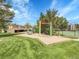 Community playground with slides, swings, and green space near a tennis court at 7318 S Xenia Cir # B, Centennial, CO 80112