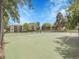 Well-maintained community tennis court with surrounding trees and buildings in the background at 7318 S Xenia Cir # B, Centennial, CO 80112