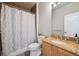 Cozy bathroom featuring a tile shower, granite countertop, and white toilet at 1100 Cherokee St # 304, Denver, CO 80204