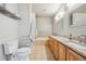 Primary bathroom features double sinks, a bathtub, and a separate glass shower at 1100 Cherokee St # 304, Denver, CO 80204
