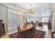 Open concept dining and living area with abundant light and hardwood floors at 1100 Cherokee St # 304, Denver, CO 80204