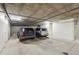 Indoor garage showing two parked cars in a well-lit parking space at 1100 Cherokee St # 304, Denver, CO 80204