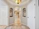 Inviting hallway featuring an archway and tiled floor that leads to an open kitchen at 1100 Cherokee St # 304, Denver, CO 80204