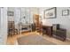 Bright home office with hardwood flooring, large windows and shutters for ample natural light at 1100 Cherokee St # 304, Denver, CO 80204
