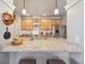 Lovely kitchen with granite countertops, stainless steel appliances, and breakfast bar at 1100 Cherokee St # 304, Denver, CO 80204